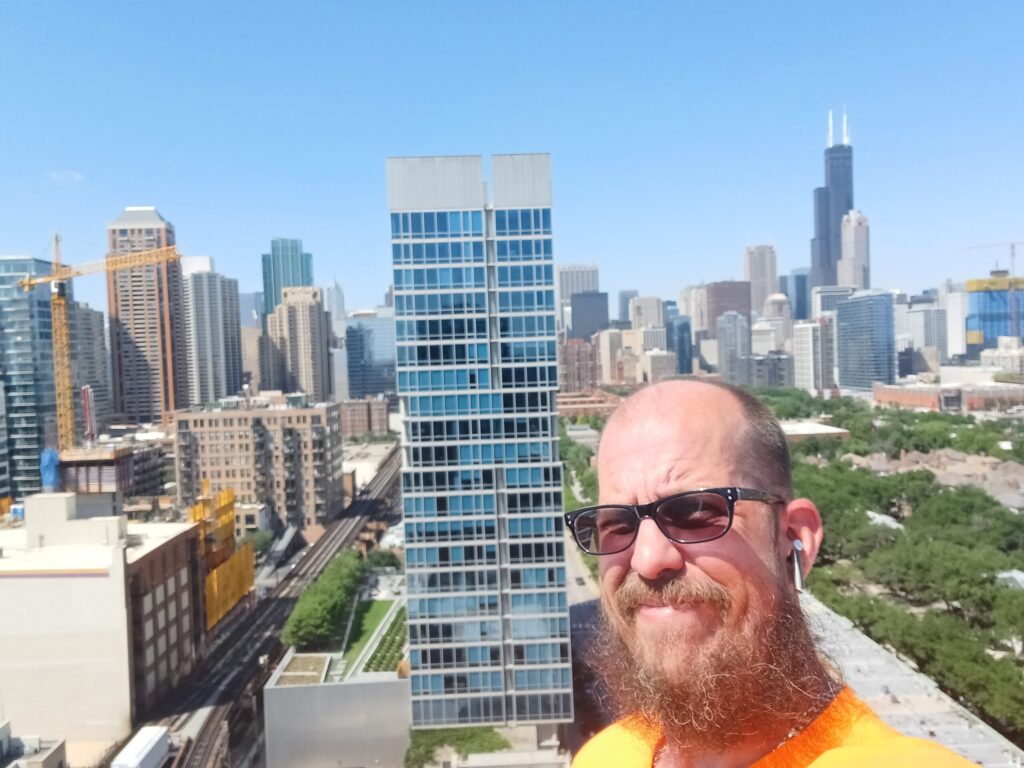 Image of Dustin Rinker on a building in Chicago. EcoBright Solution LLC